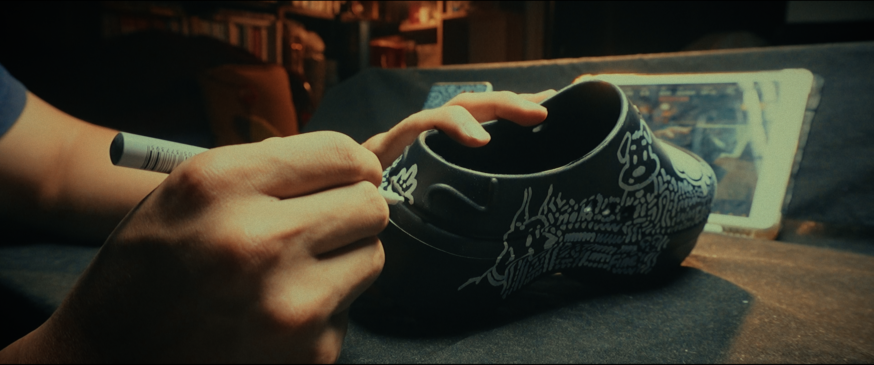 Drawing a puppy design onto a pair of slides